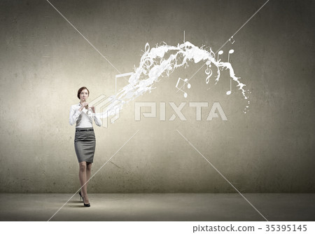 Businesswoman playing fife 35395145