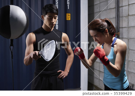 Young man, young woman, boxing 35399429