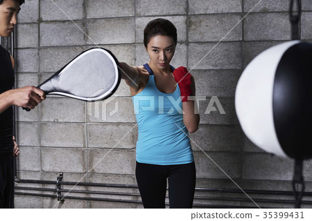 Young man, young woman, boxing 35399431