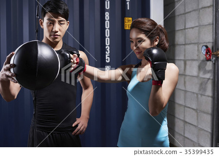 Young man, young woman, boxing 35399435