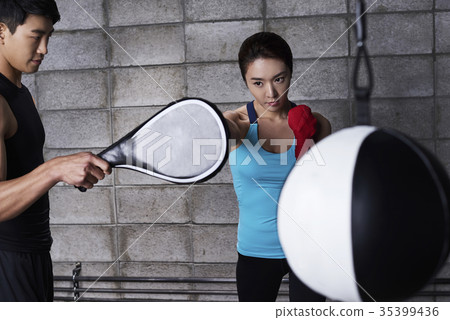 Young man, young woman, boxing 35399436