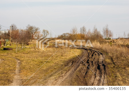 Dirty spring road in the countryside Dirty spring road in the countryside 35400135