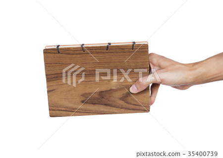 Hand holding hand made book isolated on white 35400739