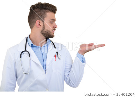 Portrait of a smiling male doctor pointing finger Portrait of a smiling male doctor pointing finger 35401204