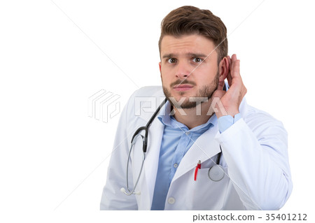 A handsome doctor gesturing silence with his 35401212