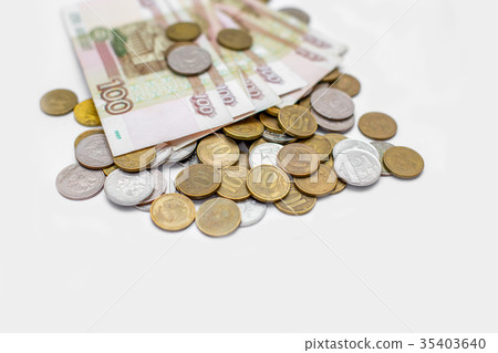 russian banknotes on a coins background russian banknotes on a coins background 35403640