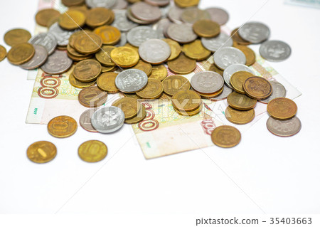 russian banknotes on a coins background russian banknotes on a coins background 35403663
