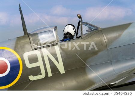 Pilot sits in cockpit of Supermarine Spitfire Pilot sits in cockpit of Supermarine Spitfire 35404580