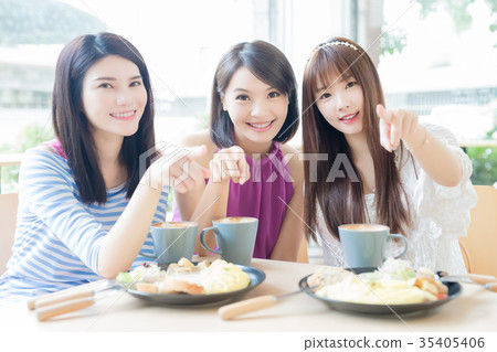 happy woman friends in restaurant happy woman friends in restaurant 35405406
