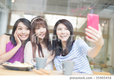 happy woman friends in restaurant happy woman friends in restaurant 35405458