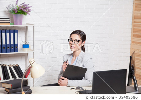 the business Secretary girl works at the computer 35405580