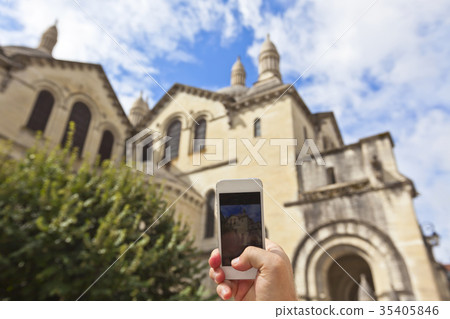 Tourist taking photo of Perigueux, France Tourist taking photo of Perigueux, France 35405846