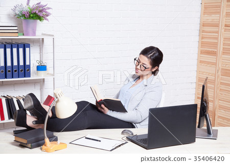 business girl works at a computer in the Office business girl works at a computer in the Office 35406420