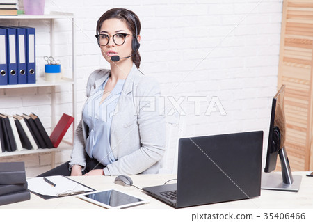 Call Center operator works at the computer in the 35406466
