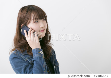 Woman using a smartphone Woman using a smartphone 35406637