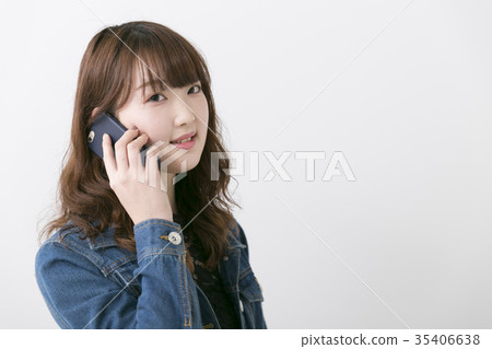 Woman using a smartphone Woman using a smartphone 35406638