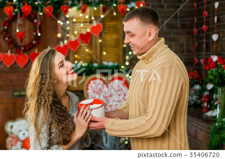 boyfriend gives girlfriend present 35406720