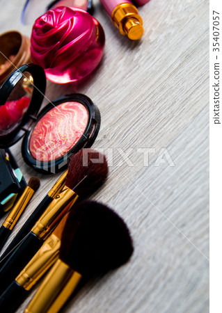Set of decorative cosmetics and brushes on grey Set of decorative cosmetics and brushes on grey 35407057