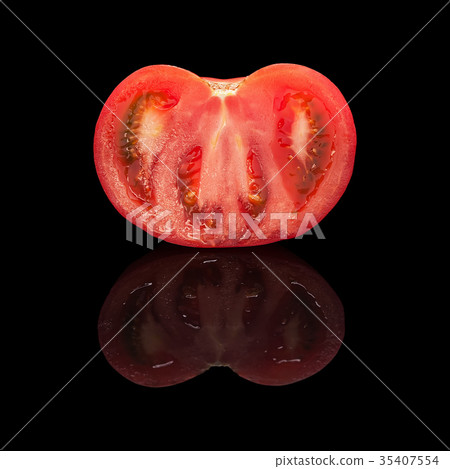 One half of the cut red tomato closeup One half of the cut red tomato closeup 35407554