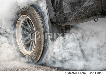 Drag racing car burn tires for the race Drag racing car burn tires for the race 35411055