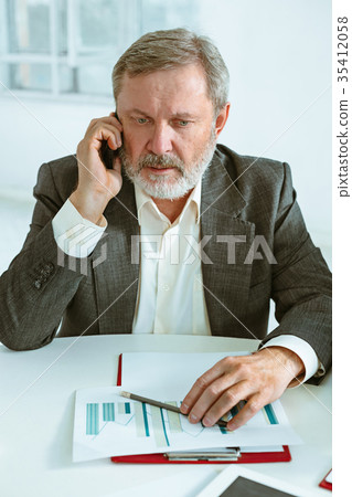 Business man working at table Business man working at table 35412058