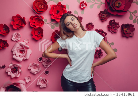 Sexy woman in a white t-shirt on a pink background 35413961