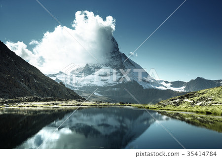Reflection of Matterhorn in lake Riffelsee, Zermatt, Switzerland 35414784