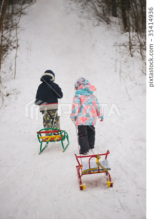 little cute girl and boy with sled little cute girl and boy with sled 35414936
