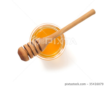 jar of honey and dipper on white background 35416079