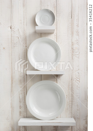 plate at kitchen shelf on wooden background plate at kitchen shelf on wooden background 35416212