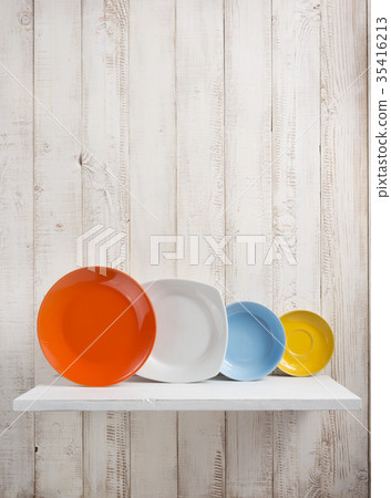 plate at kitchen shelf on wooden background plate at kitchen shelf on wooden background 35416213
