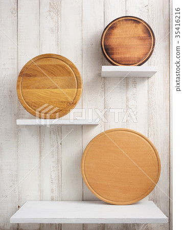 pizza cutting board at shelf on  wooden background 35416216