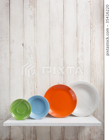 plate at kitchen shelf on wooden background plate at kitchen shelf on wooden background 35416220
