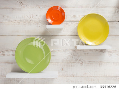 plate at shelves on white wooden background 35416226