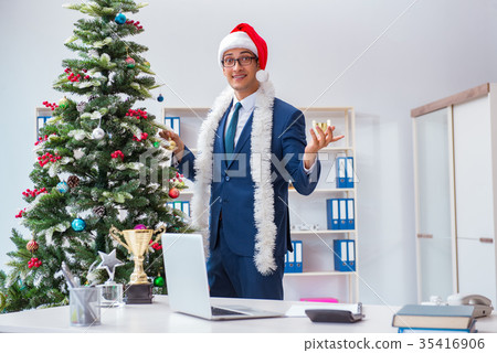 Businessman celebrating christmas holiday in the 35416906