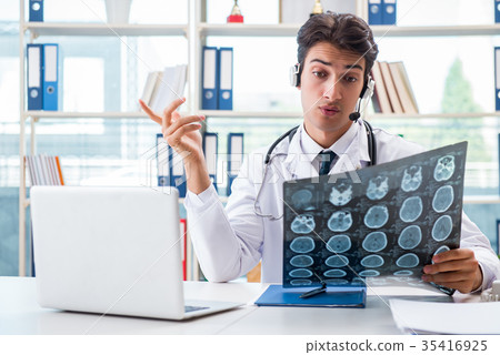 Young male doctor in telehealth concept 35416925