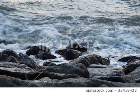 Waves hitting rocks 35419428