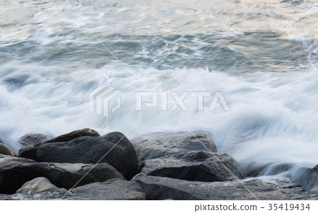 Waves hitting rocks 35419434