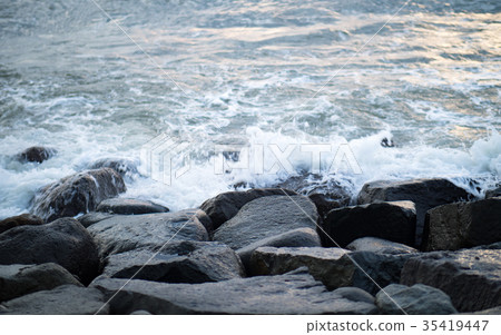 Waves hitting rocks Waves hitting rocks 35419447