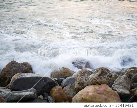 Waves hitting rocks 35419481