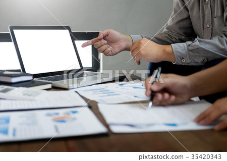 Business team meeting present in laptop with new startup project 35420343