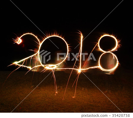 boy write 2018 happy new year firework sparkle boy write 2018 happy new year firework sparkle 35420738
