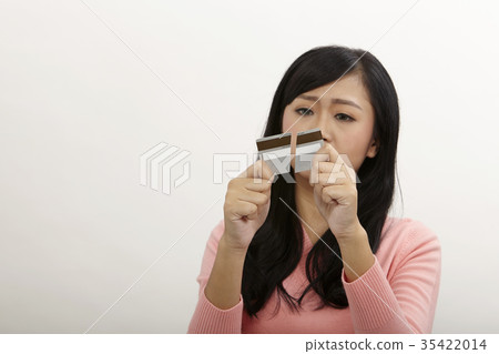 woman showing credit being destroy 35422014
