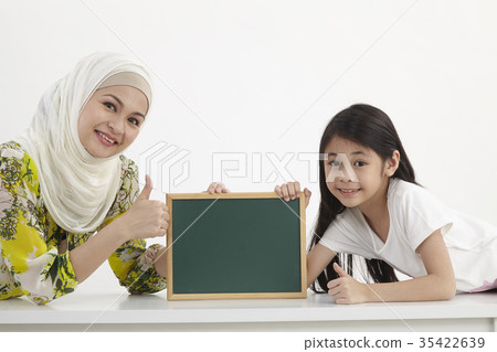 mother and daughter holding blackboard mother and daughter holding blackboard 35422639