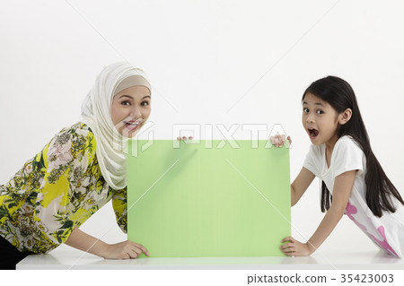 mother and daughter holding together mother and daughter holding together 35423003
