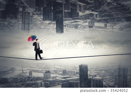 Man with colorful umbrella Man with colorful umbrella 35424052