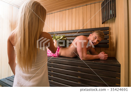Young couple relaxing in a steam bath Young couple relaxing in a steam bath 35424691