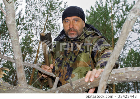 Brutal man chopping wood Brutal man chopping wood 35425448