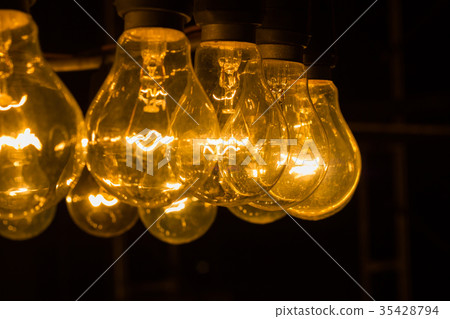 vintage light bulbs  in the night with copyspace 35428794