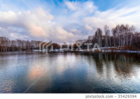 Naked autumn trees on the shore of the lake 35429394